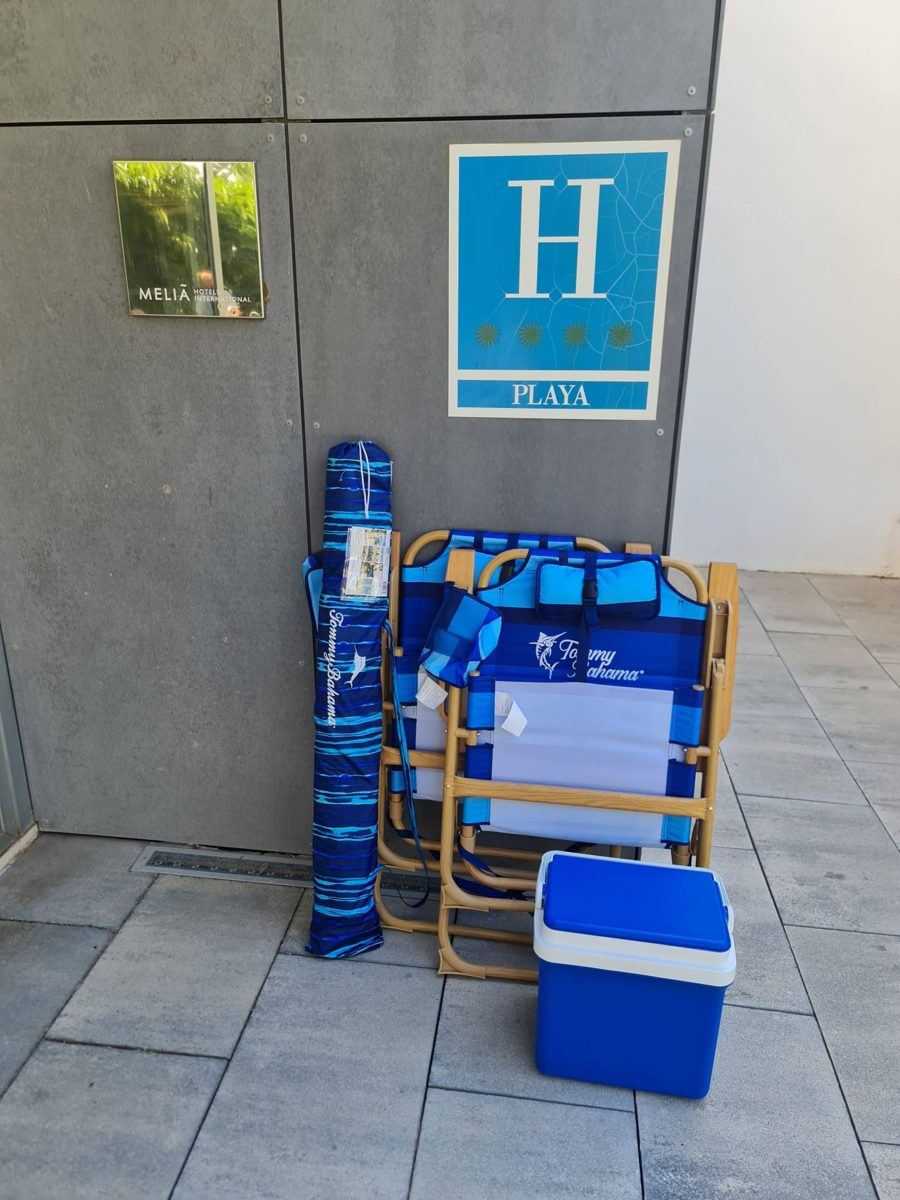 Two Tommy Bahama chairs, an umbrella and a cooler delivered at a beachfront hotel